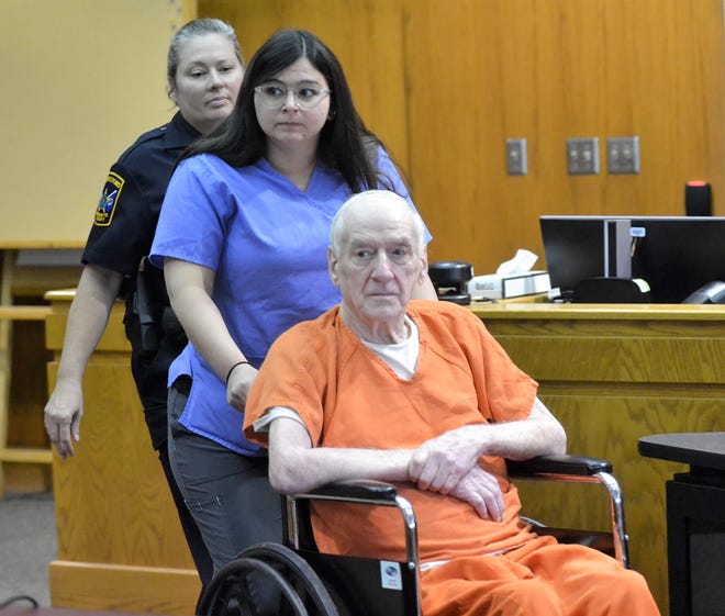Raymand Vannieuwenhoven of Lakewood is escorted into Marinette County Circuit Court on Thursday for his sentencing for the July 9, 1976, murders of David Schuldes and Ellen Matheys of Green Bay. He received two life sentences for the crime.