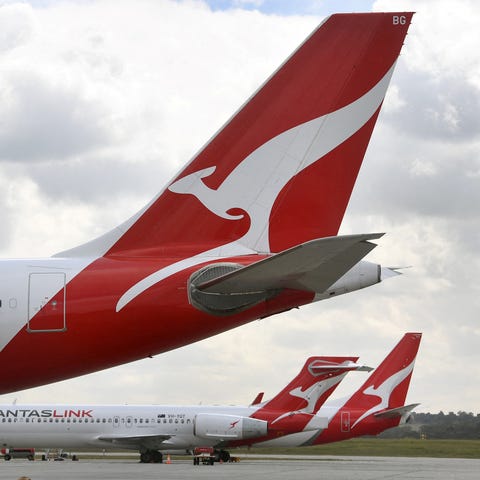 Qantas planes sit idle at Melbourne Airport on Aug