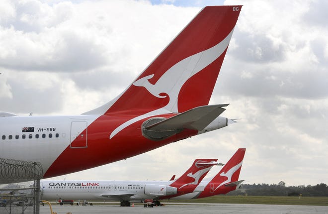 Qantas planes sit idle at Melbourne Airport on August 26, 2021 as Australian airline Qantas posted $1.7 billion in annual losses, after what it described as a "diabolical" year caused by pandemic travel restrictions.