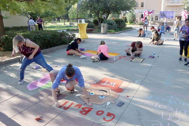 Students and faculity get creative for the Chalk at Spirit Rock, which is part of the West Texas A&M University's First Friday Festival. The event will be held on the first Friday of the month during the semester.