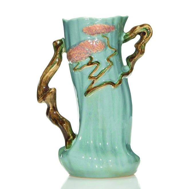 Each of the Ming Tree vases sold separately at a Humler & Nolan auction. The blue gray vase (pictured here) sold for $489, the light blue vase for $431, and the turquoise blue vase for $401.