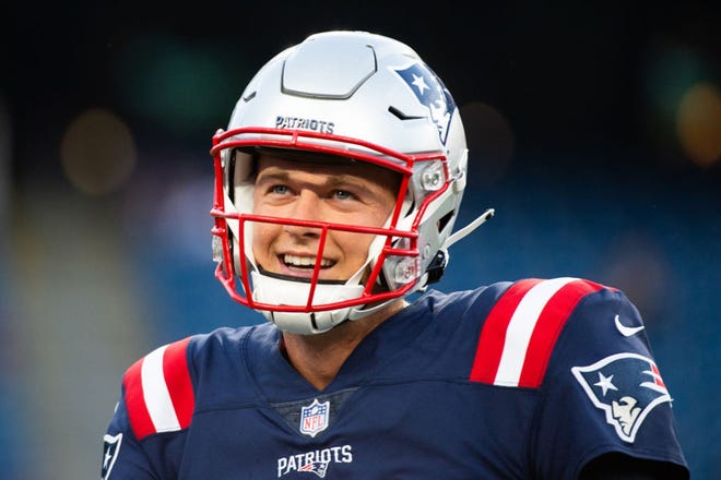 Mac Jones #10 of the New England Patriots smiles during warm ups prior to the start of the game against the Washington Football Team at Gillette Stadium on August 12, 2021 in Foxborough, Massachusetts. (Kathryn Riley/Getty Images/TNS)