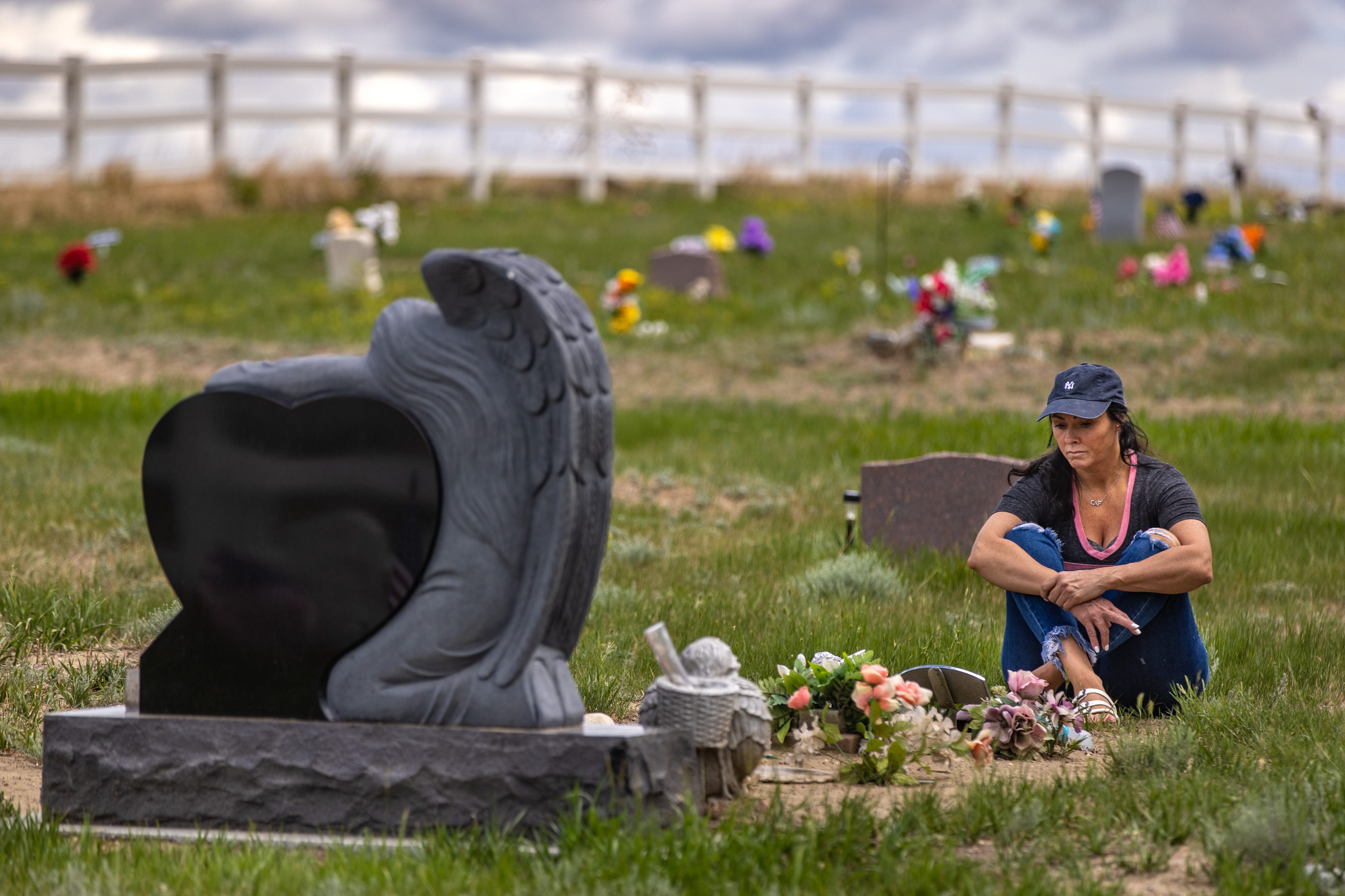 Rhonda Packineau visits the grave of her daughter, Cheyenne, at a cemetery on the Fort Berthold Indian Reservation. A sports injury years ago led to Cheyenne’s pain pill addiction. She died of a fentanyl overdose in 2018 on the eve of rehab.