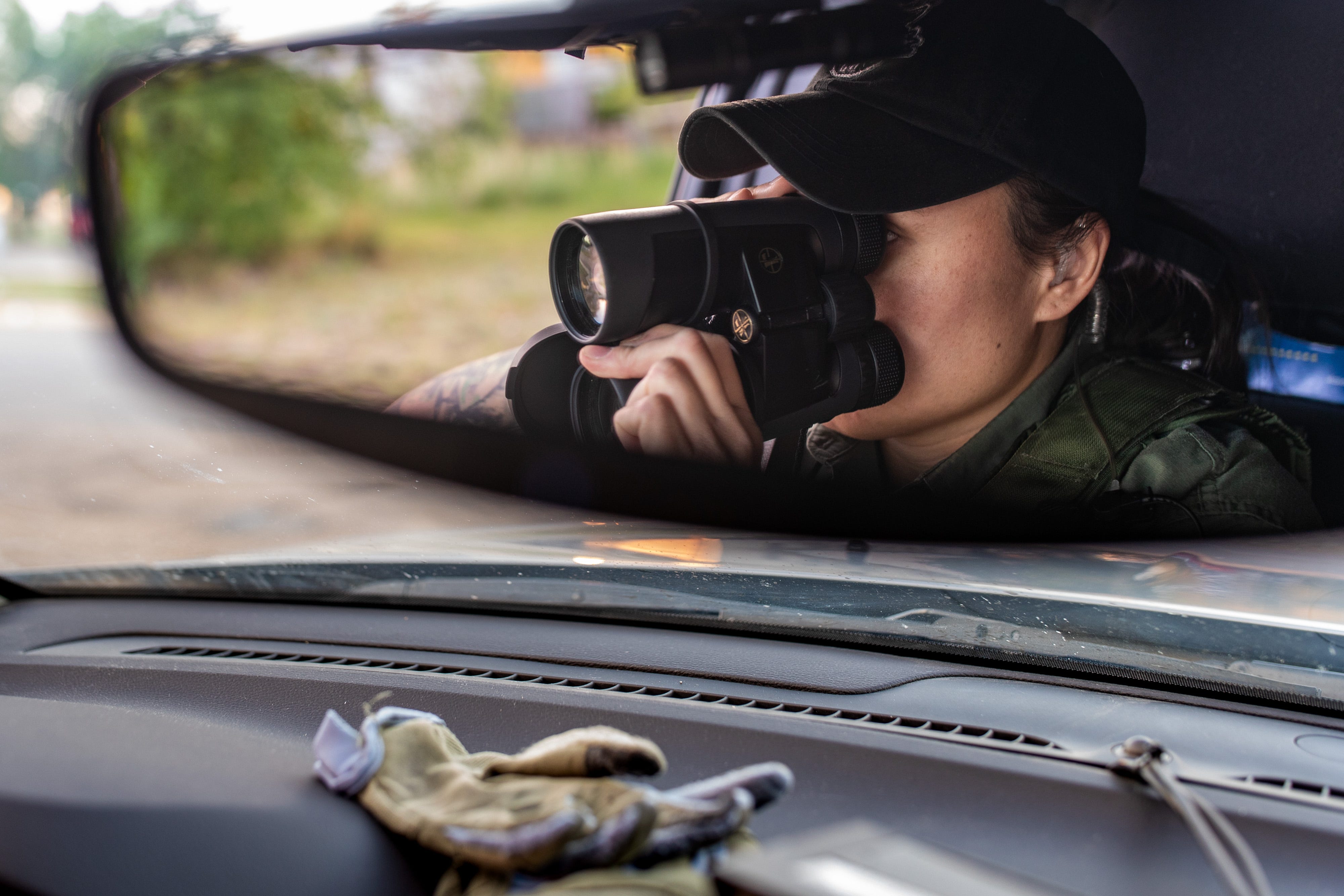 MHA Drug Enforcement patrol agent and K9 handler, Britney Larvie, watches for suspicious activity while on patrol in Parshall, North Dakota. June 25, 2021