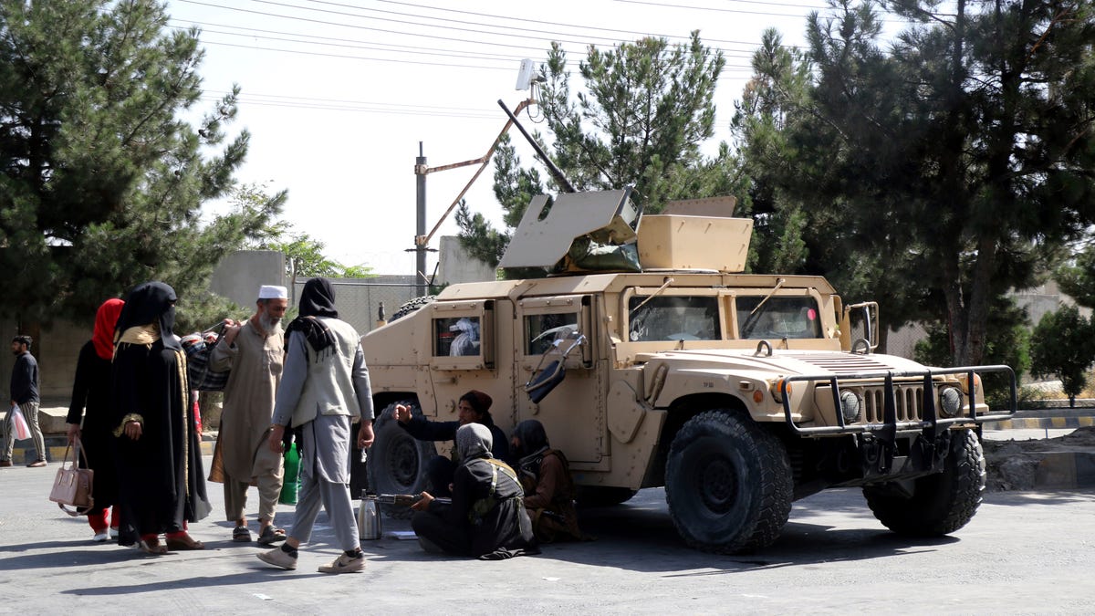 Taliban fighters guard outside the airport in Kabul, Afghanistan, on Aug. 27, 2021, a day after deadly attacks.