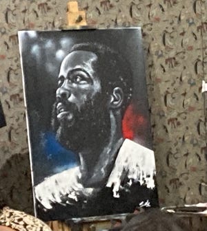 The finished painting of Perth Amboy basketball legend Brian Taylor