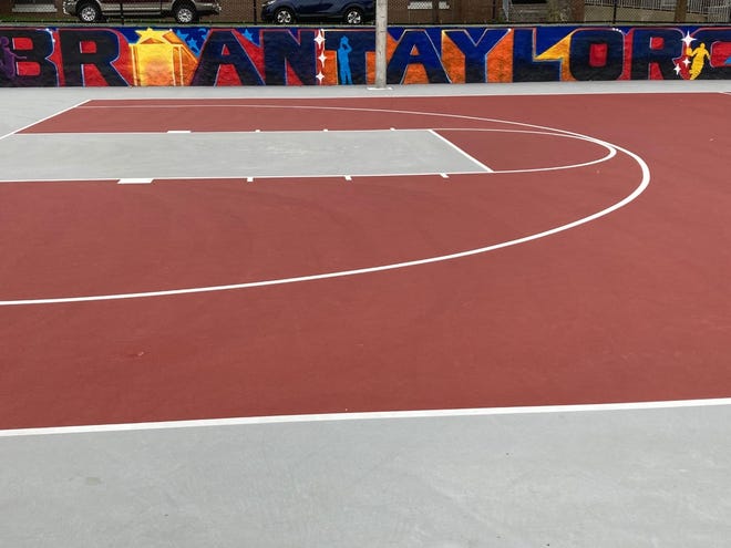 The painted wall pays homage to Perth Amboy basketball legend Brian Taylor on the Washington Park basketball courts.