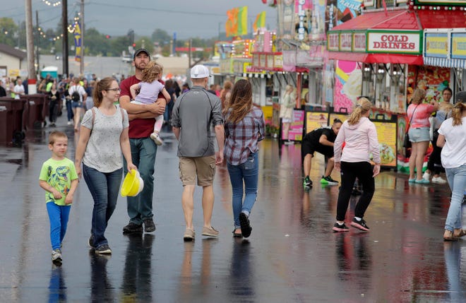The blacktop at the Manitowoc County Fair had a sheen on it from the rains, Friday, August 27, 2021, in Manitowoc, Wis.