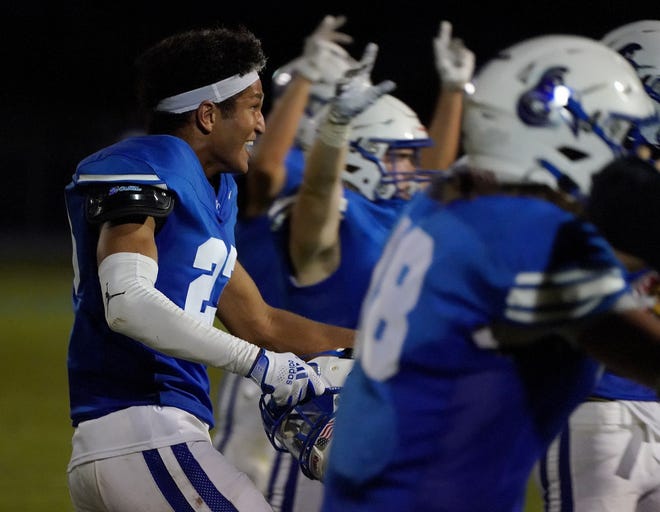 Valley Christian's Christian Bell 23, celebrates with this team after they beat Snowflake during they game  Aug, 27, 2021 at Valley Christian High School in Chandler.  Bell had a late interception to seal Valley Christian's win.