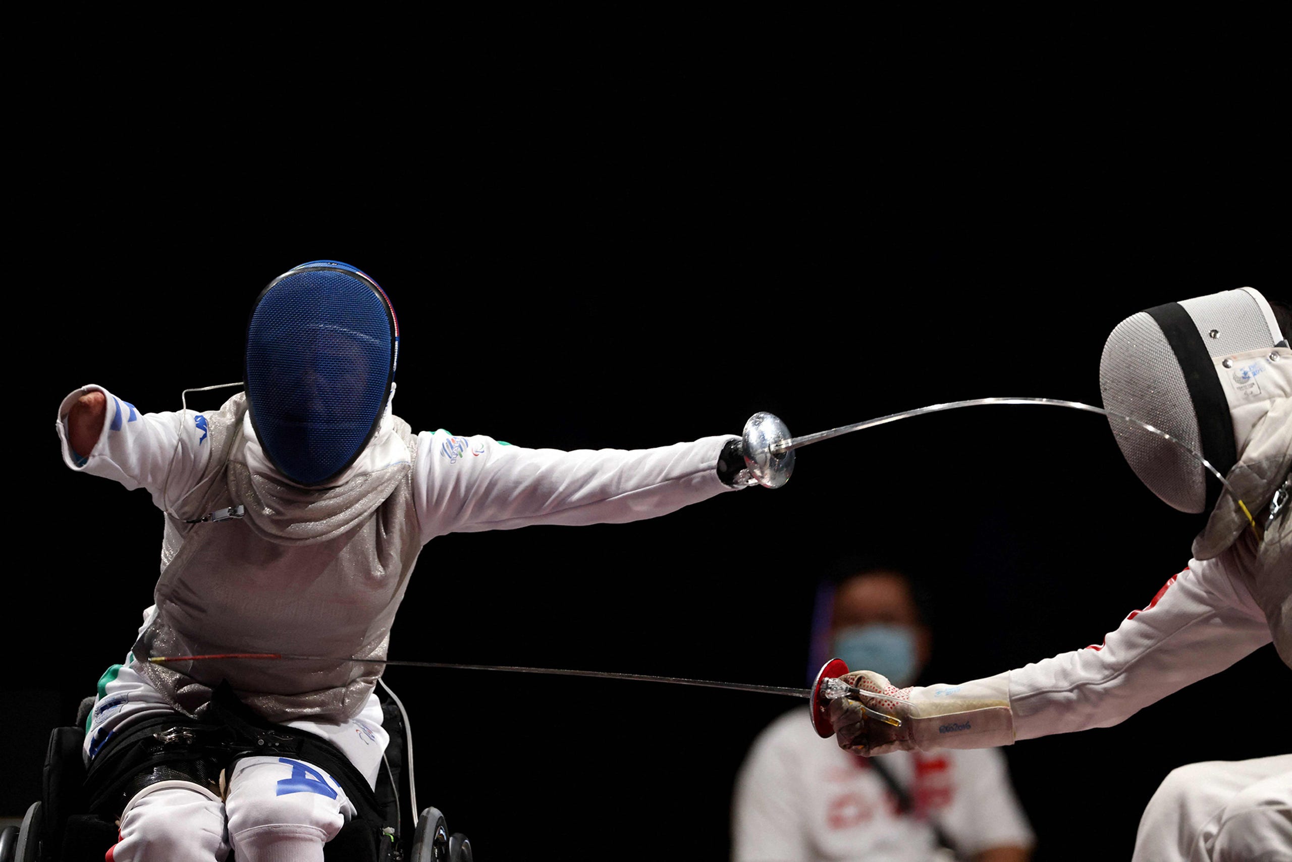 Aug. 28, 2021: Italy's Beatrice Vio (L) reacts for a point as she competes with China's Jingjing Zhou in the wheelchair fencing women's foil individual category B final bout during the Tokyo 2020 Paralympic Games at Makuhari Messe Hall in Chiba .