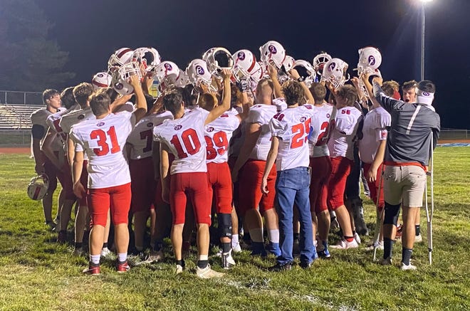 The Owen Valley varsity football team celebrated their win over South Putnam Friday night, 29-13. After the post-game talk with Coach Rob Gibson, the team huddles up, ending with a loud chant of 'family.' Building a program, building a legacy... is this the new 'Family Tradition?' More from Friday night's game is featured inside today's Spencer Evening World
