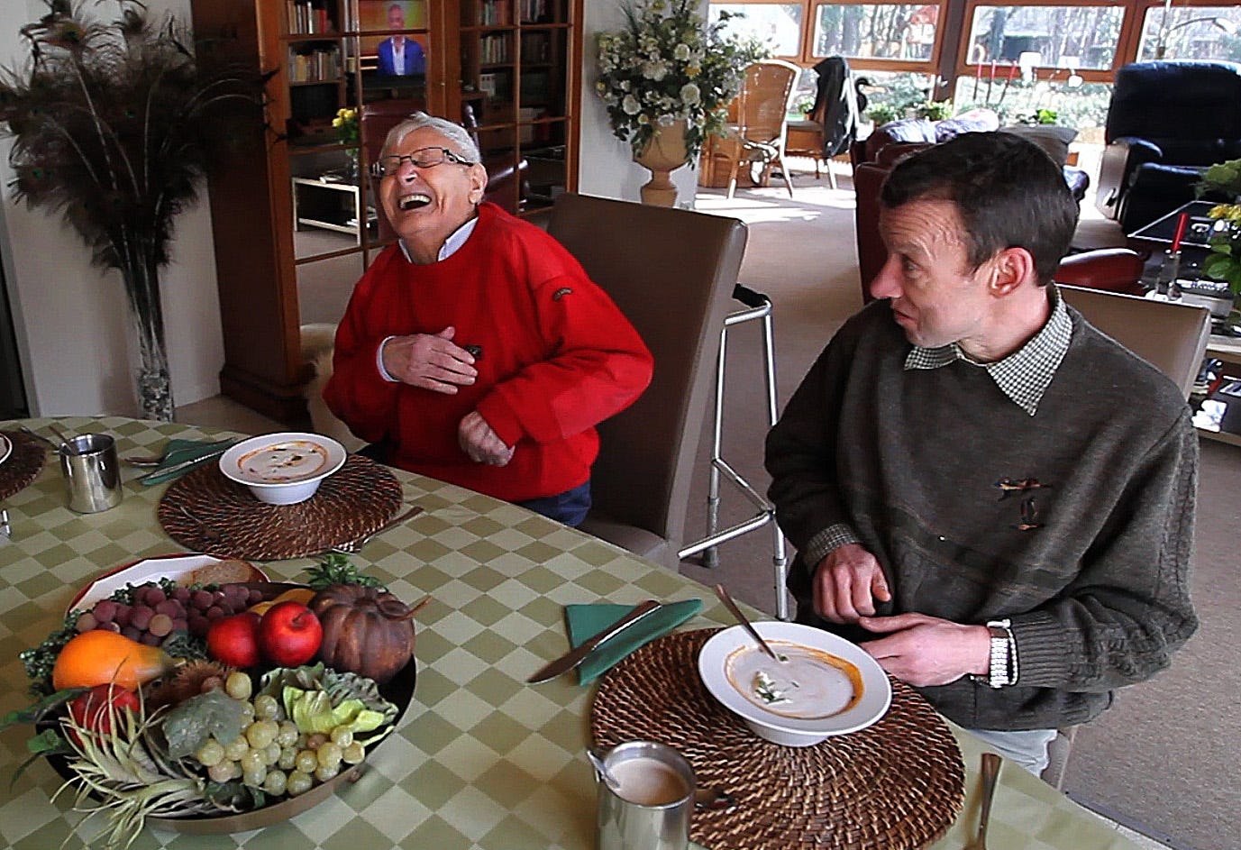 Like brothers, Dis, left, and Luc joke around during lunch at their home in Geel, Belgium. January 25, 2013.