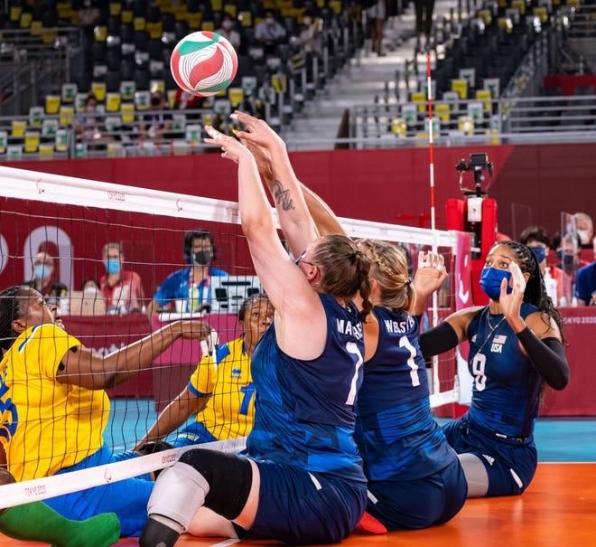 Ardmore native Monique Matthews (7) goes up for a block Monday against China. Matthews led all scorers with 11 points in the 3-0 loss.