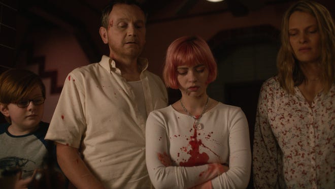 From left: John James Cronin, Pat Healy, Sierra McCormick and Vinessa Shaw in a scene from "We Need to Do Something."