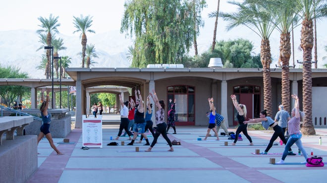 Students kick off the fall semester at College of the Desert with a Monday morning yoga class on Aug. 30, 2021. Masks are required indoors on campus but not outside.