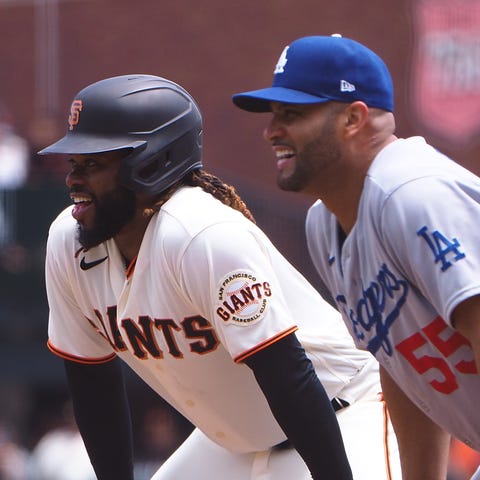 Giants pitcher Johnny Cueto and Dodgers first base