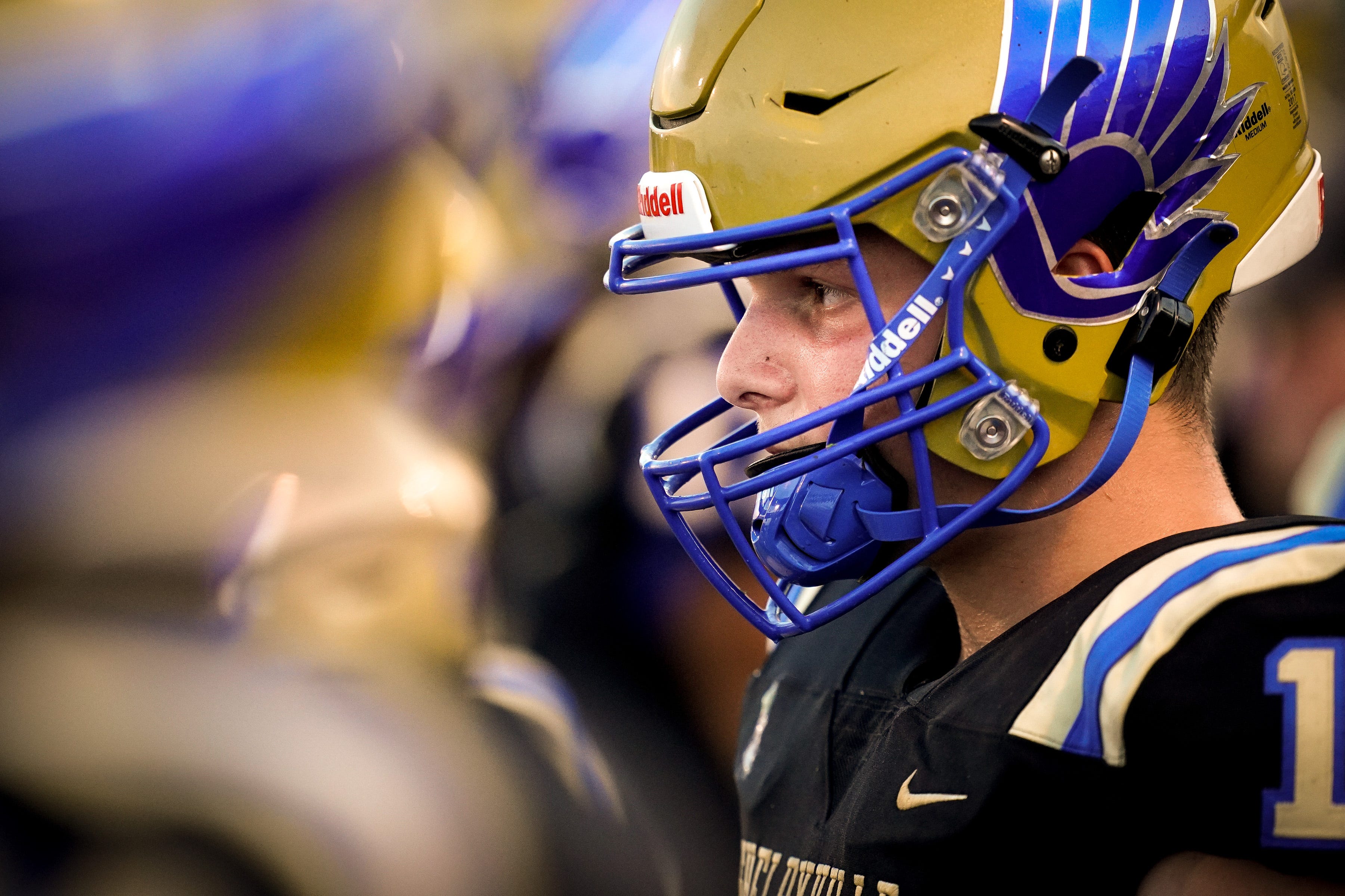 Shelbyville Central's Cayden Puckett (12) watches his teammates face Tullahoma at Shelbyville Central High School in Shelbyville, Tenn., Thursday, Aug. 19, 2021. Puckett returned to the field for the first time on Thursday, eight months after being diagnosed with COVID-19, and about seven months after learning he had myocarditis.