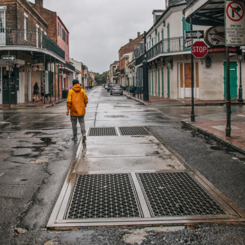 A person walks through New Orleans' French Quarter