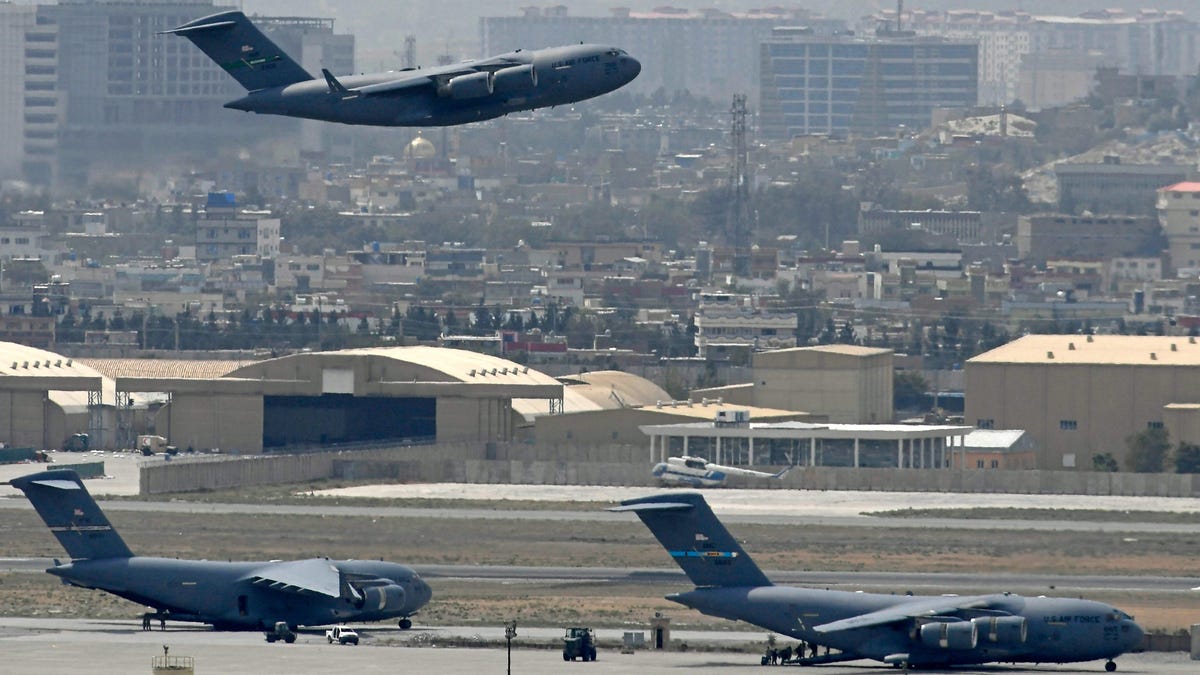 An US Air Force aircraft takes off from the airport in Kabul on August 30, 2021. Rockets were fired at Kabul's airport on August 30 where US troops were racing to complete their withdrawal from Afghanistan and evacuate allies under the threat of Islamic State group attacks. 