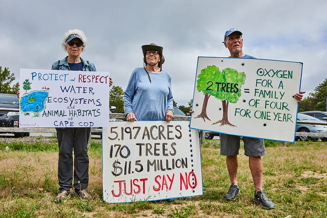 Barbara Ahalt, Kat Brennan and Bill Grant attend a June 26 protest in Sandwich against the proposed machine-gun range project at Joint Base Cape Cod.