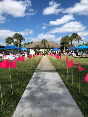 Pink flags are purchased by players and attendees for a friend or relative who is either sick or has passed away from cancer. SenioRITAs has an artist who will write a memory notation on the flag. The flags are sold for $10 each at the Pusser's Bar and Grille night and also during the tennis tournament.