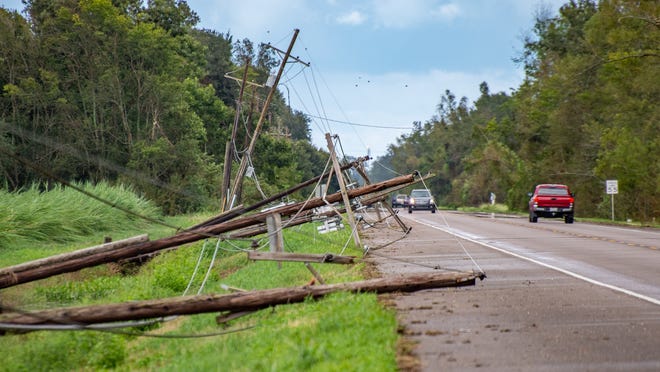 Downed powerlines are seen down across Donaldsonville, Louisiana, after Hurricane Ida came through the region Monday, Aug. 30, 2021.