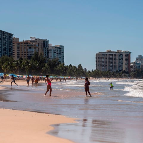 People are seen on the beach despite the governor 