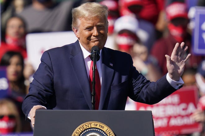 Former President Donald Trump, shown at a campaign rally in 2020, was booed recently when he suggested to supporters that they get the COVID-19 vaccine. [AP PHOTO/JOHN LOCHER/FILE]