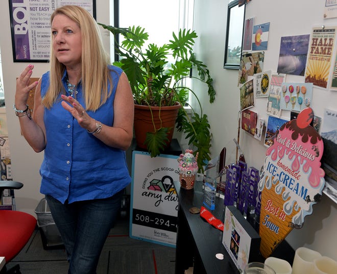 Amy Dwyer discusses her love of ice cream in her Keller Williams Realty Framingham office.