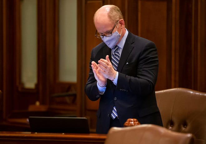 Illinois Senate President Don Harmon, D-Oak Park, claps as the omnibus energy bill passes in the early morning hours Wednesday on the floor of the Illinois Senate at Capitol. [Justin L. Fowler/The State Journal-Register]