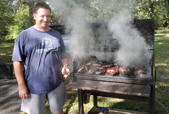 Mike Fooshe cooking for the family's Waverly fundraiser