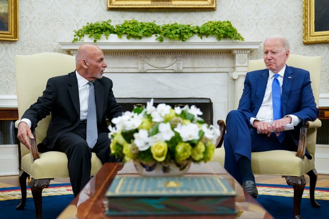President Joe Biden, right, meets with Afghan President Ashraf Ghani, left, in the Oval Office of the White House in Washington, Friday, June 25, 2021. (AP Photo/Susan Walsh) ORG XMIT: otkw102