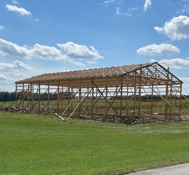 Men from the community gathered this week to work on Dustin’s pole barn after the recent storm damage.