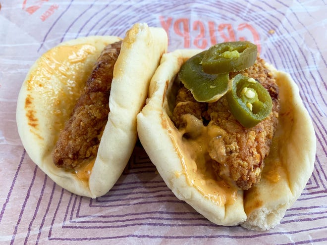 The Crispy Chicken Sandwich Taco (left) and the Spicy Crispy Chicken Sandwich Taco from Taco Bell.