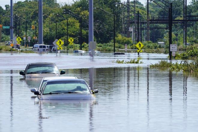 Vehicles are under water during flooding in Norristown, Pa., Thursday in the aftermath of downpours and high winds from the remnants of Hurricane Ida. (AP PHOTO/MATT ROURKE]