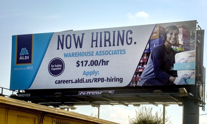 An Aldi billboard on Okeechobee Blvd. near Tallahassee Dr. says the company is now hiring warehouse associates for $17/hr, September 3, 2021.