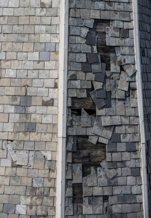 Slate tiles are falling off the west spire of St. Joseph Church in the Butchertown neighborhood of Louisville, Kentucky. The church is currently undergoing a restoration. July 19, 2021