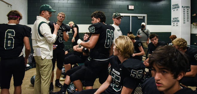 Williamston head football coach Steve Kersten instructs his team Thursday, Sept. 2, 2021, during half-time in their game against Lansing Catholic.  Williamston.  Lansing Catholic won 30-21.
