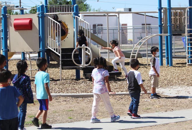 Kindergarten students at MacArthur Community Elementary School play during recess before lunch on Friday, Sept. 3, 2021.