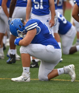 Detroit Catholic Central lineman Ben Flake, pictured here before the Davison game, helped the Shamrocks upend Brother Rice Sunday in football.