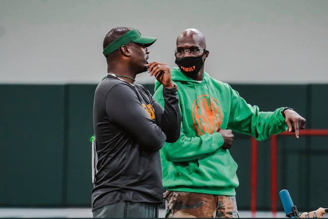 Former NFL wide receiver Chad Ochocinco (right) talks with FAMU head coach Willie Simmons during football practice for the Rattlers at the University of Miami on Friday, Sept. 3, 2021.