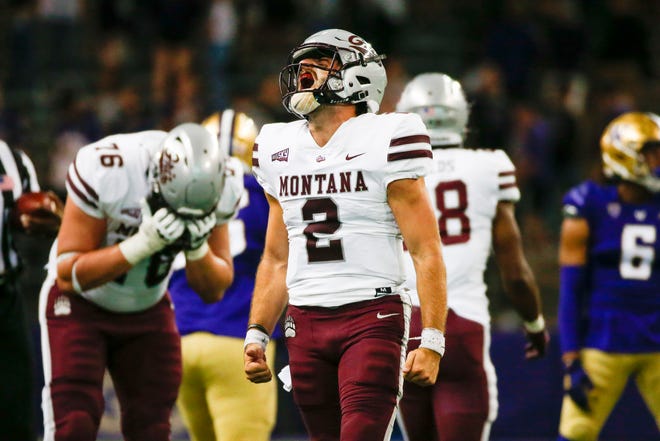 Montana quarterback Camron Humphrey celebrates the Grizzlies' 13-7 victory over Washington at Husky Stadium.