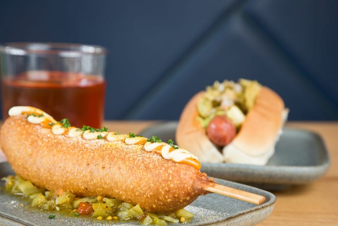 The corn dog and Fire on the Mountain hot dog with the Pepe Silvia cocktail at Law Bird