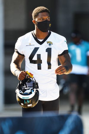 Jaguars DE/OLB (41) Josh Allen wearing his mask, heads to the practice fields from TIAA Bank Field for Wednesday's training camp session. The Jacksonville Jaguars training camp session, Wednesday, July 28, 2021 at the teams practice fields outside TIAA Bank Field. [Bob Self/Florida Times-Union]
