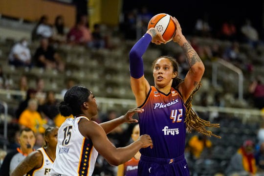 Phoenix Mercury center Brittney Griner (42) shoots over Indiana Fever forward Teaira McCowan (15) in the first half of a WNBA basketball game in Indianapolis, Monday, Sept. 6, 2021. (AP Photo/Michael Conroy)