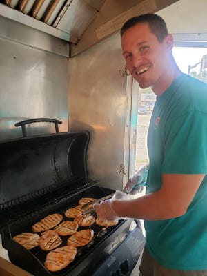 Bud's Apple Cider Slush owner, Brian Seals, grilled up butterfly pork chops over the Hog Days weekend. The chops aren't a normal menu item, but Seals added them after customers began to request them for the Labor Day event.