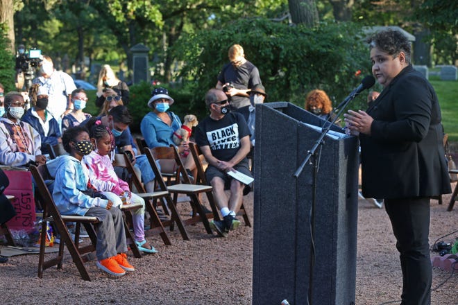 Ald. JoCasta Zamarripa opens the ceremony for the unveiling of the grave marker for George Marshall Clark.