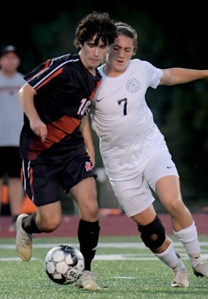 Northeastern's Caleb Snyder, left, and Dallastown's Aiden Keja battle for possession earlier this season. Both Snyder and Keja will participate in the York-Adams League Senior All-Star Boys’ Soccer Game at 6:30 p.m. Thursday, Nov. 18, at Dallastown.