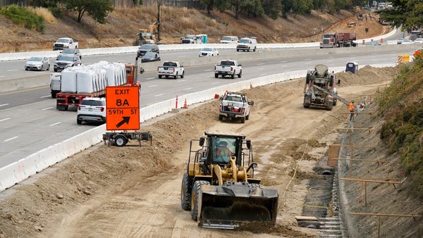 Traffic flows past construction work on eastbound 