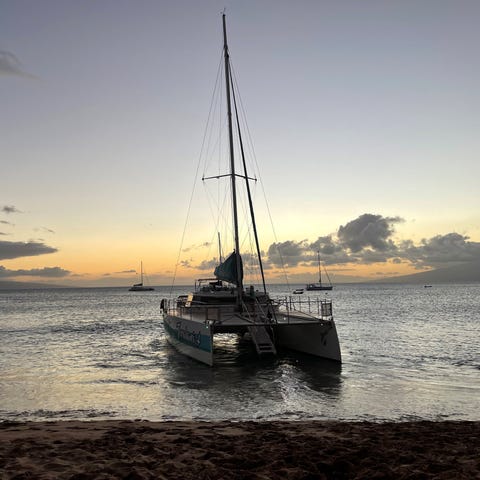 A catamaran operated by Teralani is anchored off K